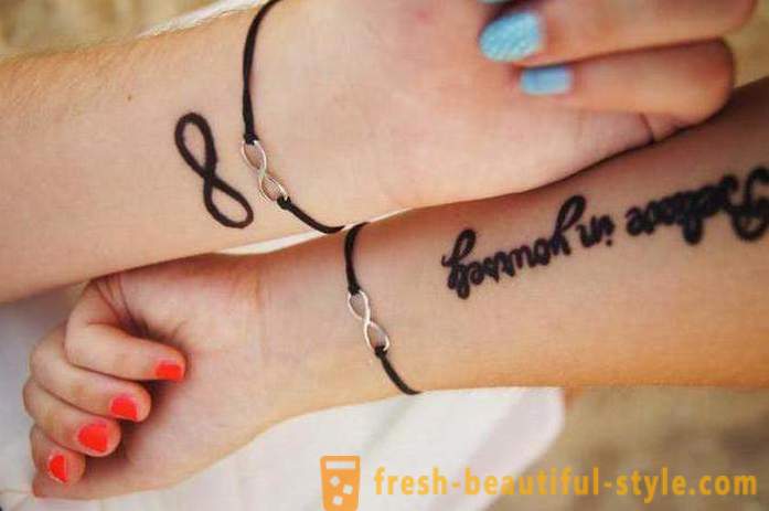 Kvinner tatovering på armen: attraktiv uttrykk