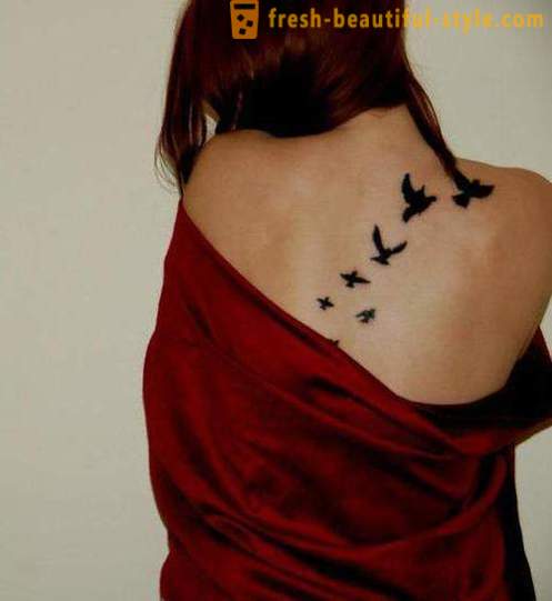 Vakre kvinnelige tatovering - som hogge og hvor det er et bilde